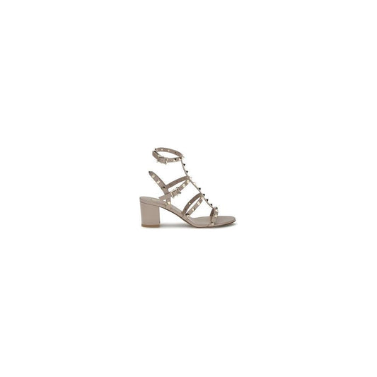 Valentino Garavani Rockstud leather sandals with adjustable ankle strap and chunky heel, featuring iconic stud detailing.